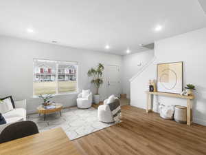 Sitting room with light hardwood / wood-style flooring