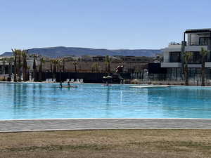 View of pool with a mountain view