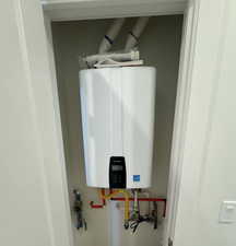 Utility room with tankless water heater