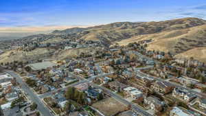 Aerial view at dusk featuring a mountain view