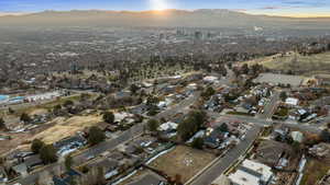 Aerial view at dusk featuring a mountain view