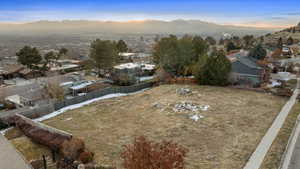 Aerial view at dusk featuring a mountain view