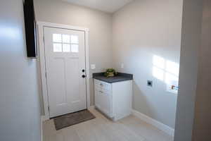 Doorway to outside with light hardwood / wood-style flooring