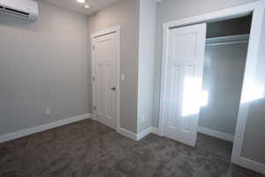 Interior space featuring a wall unit AC