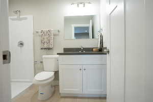 Bathroom featuring vanity and toilet