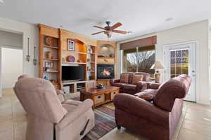 Living room with loungers and built in shelves