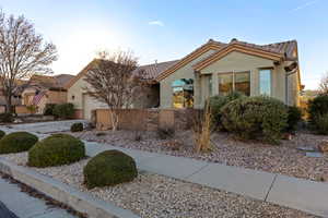 View of front of property with xeriscaping