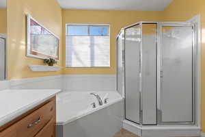 Bathroom with plus walk in shower and vanity