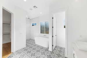 Bathroom featuring tile patterned floors and independent shower and bath