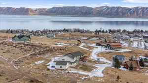 Drone / aerial view featuring a water and mountain view