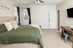 Bedroom featuring ceiling fan and light carpet