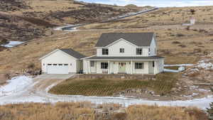 View of front of home featuring a mountain view and covered porch