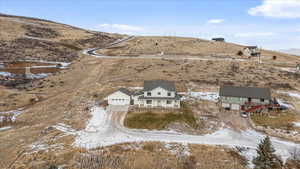 Snowy aerial view featuring a mountain view