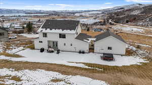 Snowy aerial view with a mountain view