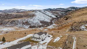 Snowy aerial view featuring a mountain view