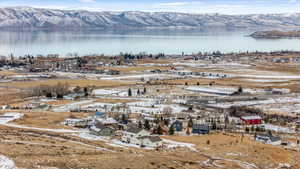 Aerial view featuring a water and mountain view