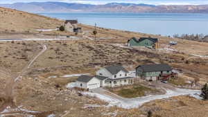 Aerial view featuring a water and mountain view