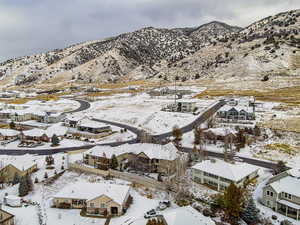 Snowy aerial view featuring a mountain view