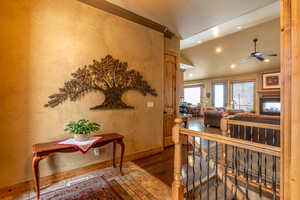 Interior space with wood-type flooring and lofted ceiling