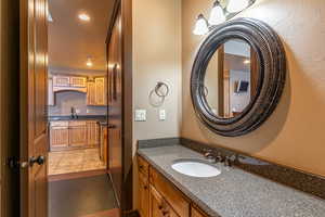 Bathroom with tile patterned flooring and vanity