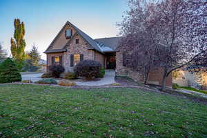 View of front of property with a yard