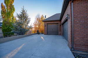 View of garage at dusk