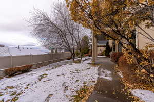 View of yard covered in snow