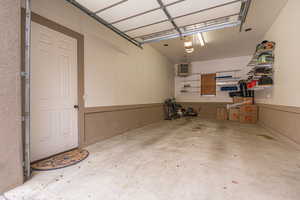 Garage featuring a garage door opener