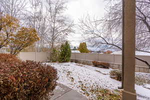 View of yard covered in snow