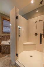 Bathroom featuring plus walk in shower