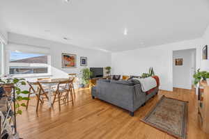 Living room with light hardwood / wood-style flooring