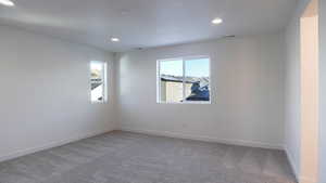 Unfurnished room featuring carpet flooring