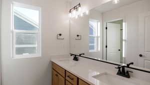 Bathroom with vanity and plenty of natural light