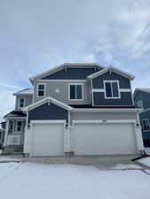 View of front of property with a garage