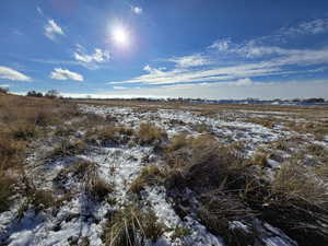 Snowy view featuring a rural view