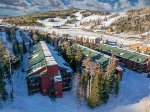 Snowy aerial view with a mountain view