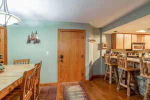 Dining space with wood-type flooring