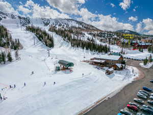 Snowy aerial view featuring a mountain view