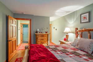 Bedroom with wood-type flooring