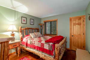 Bedroom with wood-type flooring