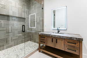 Bedroom 3 ensuite featuring vanity and a stall shower