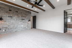 Primary Bedroom with a fireplace, a deck, a stone walls and Jordanelle and Deer Valley Views.