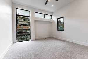 Guest bedroom featuring carpet flooring, recessed lighting, and ceiling fan