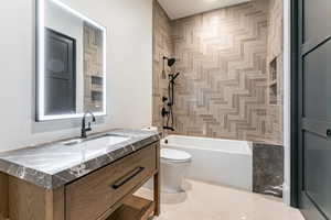 Bedroom 2 ensuite. Full bathroom with vanity and shower / bath combination