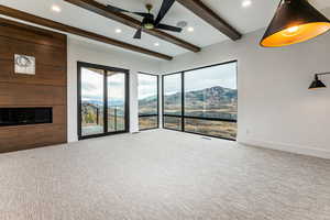 Primary Bedroom with a fireplace, a deck, a stone walls and Jordanelle and Deer Valley Views.