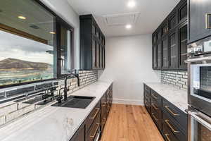 Butlers Pantry wit Double Oven, sink, dish washer and work space.