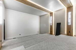 Unfurnished bedroom with carpet and baseboards