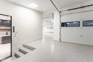 Over sized 3 gar garage with 220 outlet, a shop and masive storage.