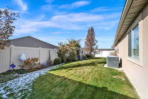 View of yard with central AC unit