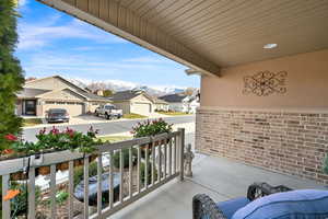 Balcony with a mountain view and covered porch